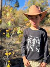 Load image into Gallery viewer, Cherokee Printed Tee Dancing Cowboy Skeleton
